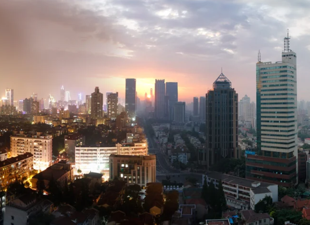 Shanghai at night AND sunrise.